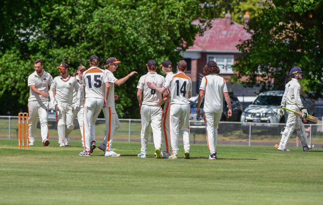 MAXED OUT: Raiders players celebrate the dismissal of South Hobart Sandy Bay's Max Denehey. Picture: Paul Scambler