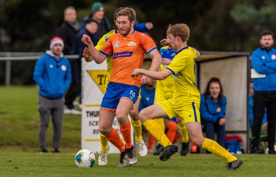FRONT MAN: Matt Spanos holds the ball up in his new role as striker for Riverside against Devonport. Picture: Phillip Biggs