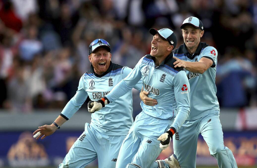 Lord's a-leaping: England's Jonny Bairstow, Jos Buttler and Chris Woakes celebrate after running out New Zealand's Martin Guptill to win the Cricket World Cup final at Lord's. Picture: AP