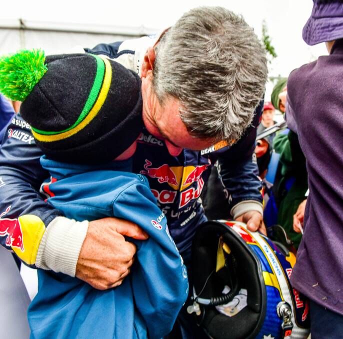 Liam Chapman and Craig Lowndes share a hug at Symmons Plains.