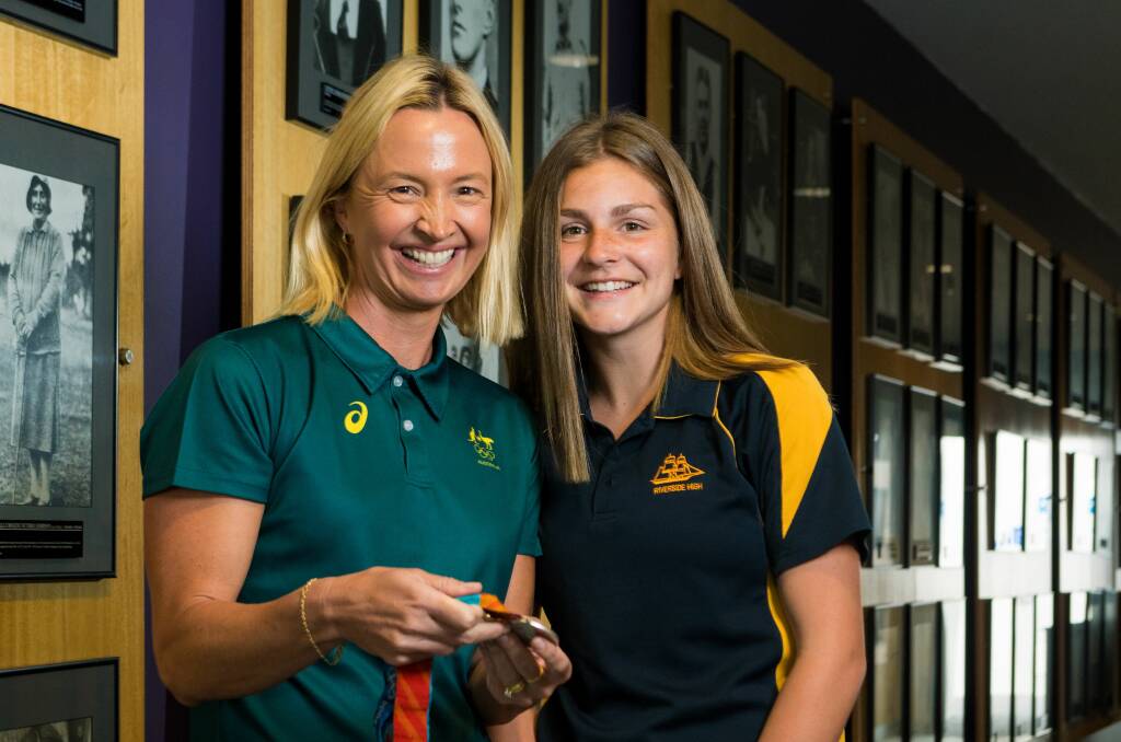 Olympic swimmer Brooke Hanson with Riverside student Aprille Crooks.