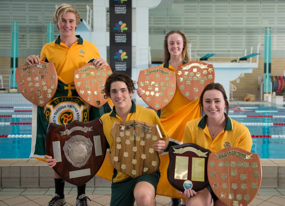 Shielded: Jordan Cooper, Ethann Best, Chelsea Ford and Morgan Stephenson-Scott with the spoils of victory. Pictures: SATIS