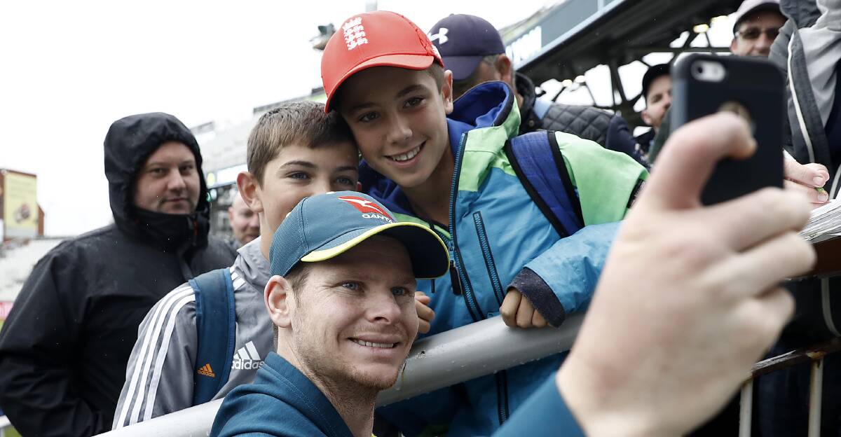 Mr popular: Smith poses with fans during day three of the Fourth Test at Old Trafford in Manchester.