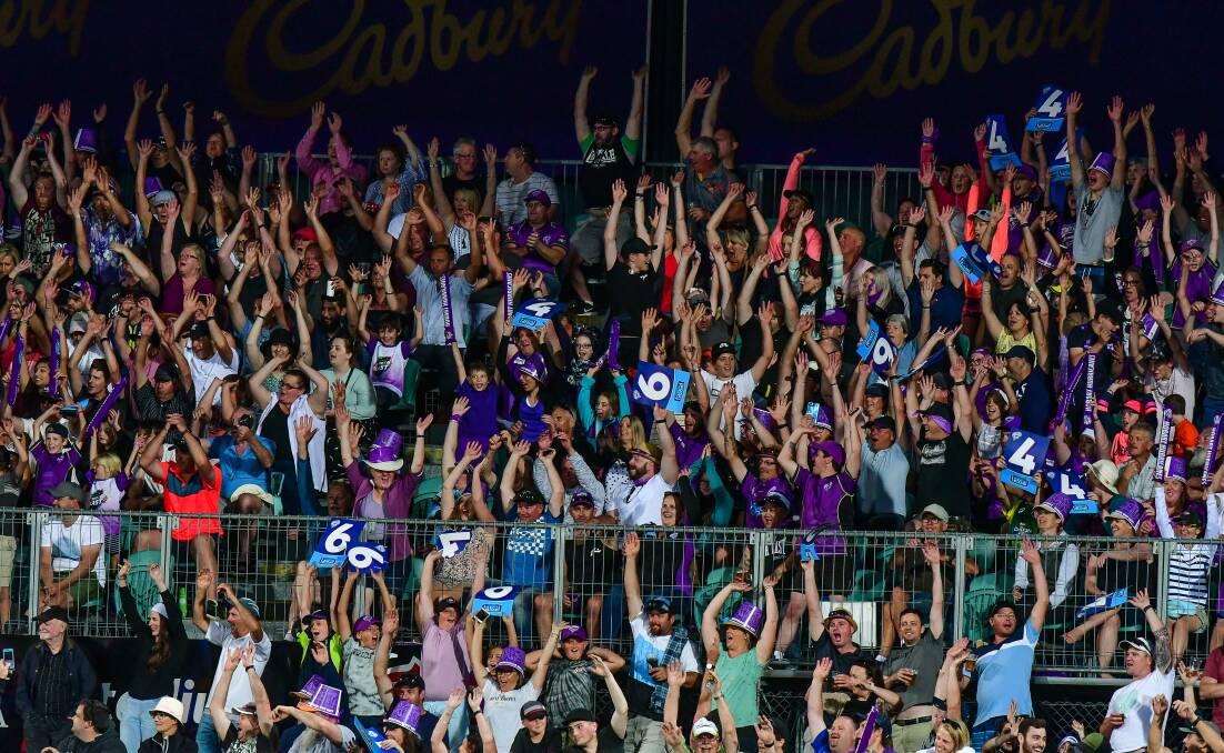 Wave goodbye: A big crowd enjoys a Mexican wave during the 2018 BBL game between Hobart Hurricanes and Perth Scorchers at UTAS Stadium in Launceston. 