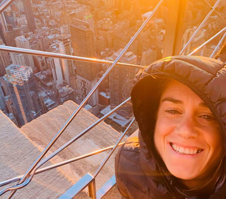 CRUNCH TIME: Milly Clark at the top of the Empire State Building in the Big Apple. Picture supplied.