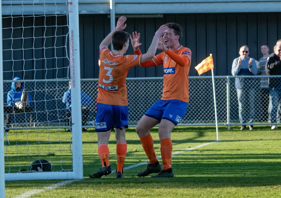 Fletcher Fulton and Will Humphrey show their delight at Riverside's superb second goal against Kingborough.