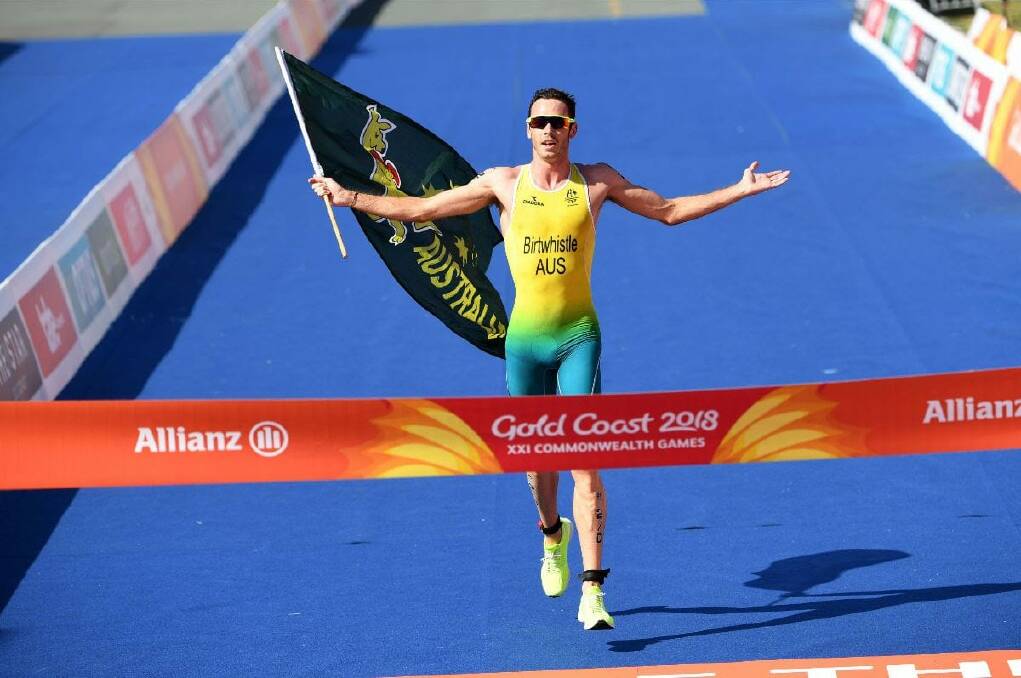ANCHOR MAN: Jake Birtwhistle anchors Australia to mixed relay triathlon gold at the 2018 Commonwealth Games. Picture: Delly Carr