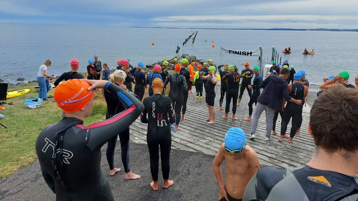 Competitors prepare to hit the water at the start of the race.