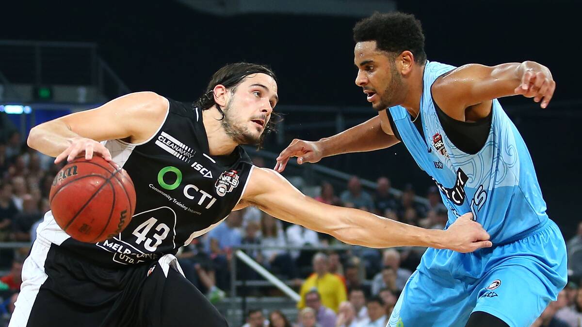 Hold on: Chris Goulding representing Melbourne United takes on Corey Webster of the New Zealand Breakers in their NBL semi-final in February.