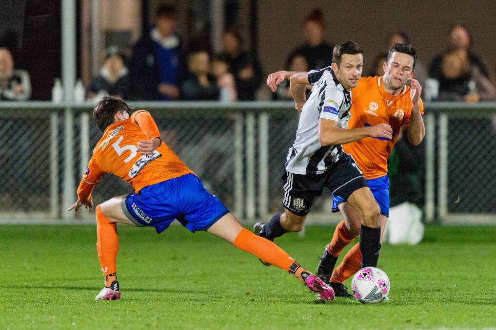 Running the show: Launceston City's Gedi Krusa skips between Riverside's Max Reissig and Todd Mitchell during the NPL Tasmania derby at Windsor Park on July 2. Picture: Phillip Biggs