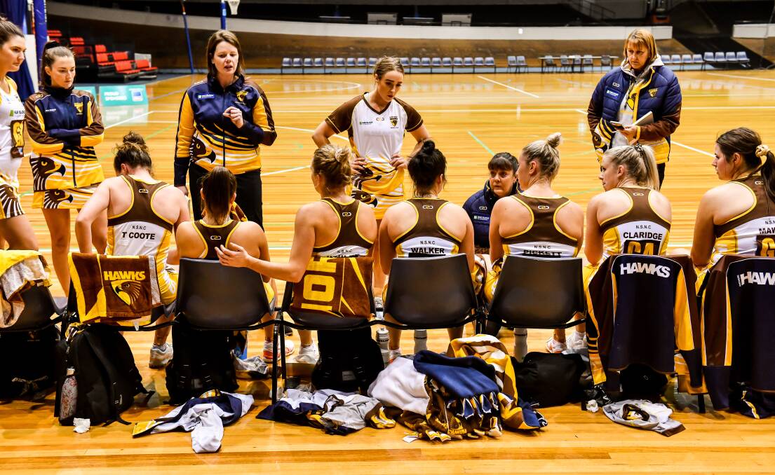 Northern Hawks players listen to co-coaches Ruth Tuohy and Kellie Woolnough during their clash with Cavaliers on Saturday. Picture: Scott Gelson