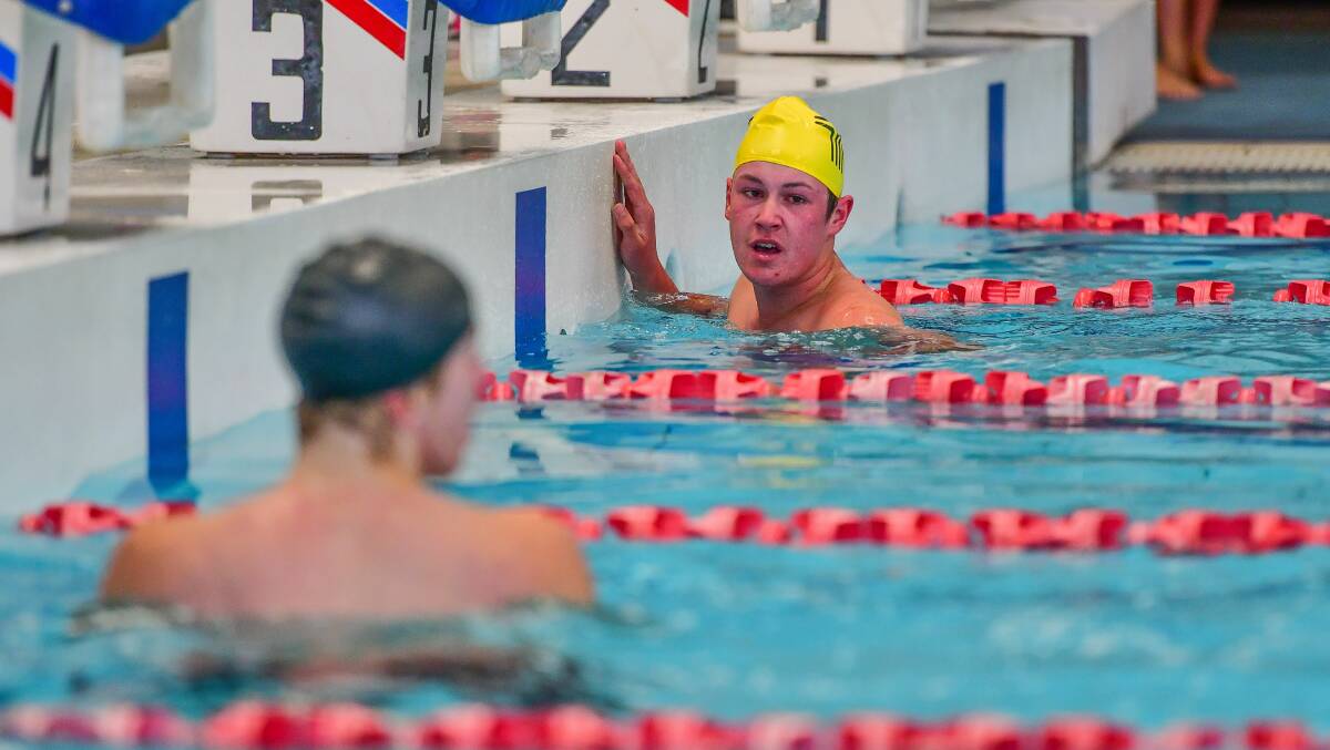 Campbell Town's Ben Longstaff looks back after winning the grade 10 boys' 50 metre freestyle.