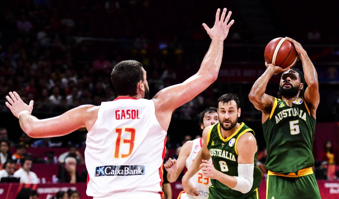 Spain barrier: Marc Gasol, of Spain, stands in the way of Australia's Andrew Bogut and Patty Mills during last week's basketball World Cup semi-final in Beijing. Picture: Getty Images