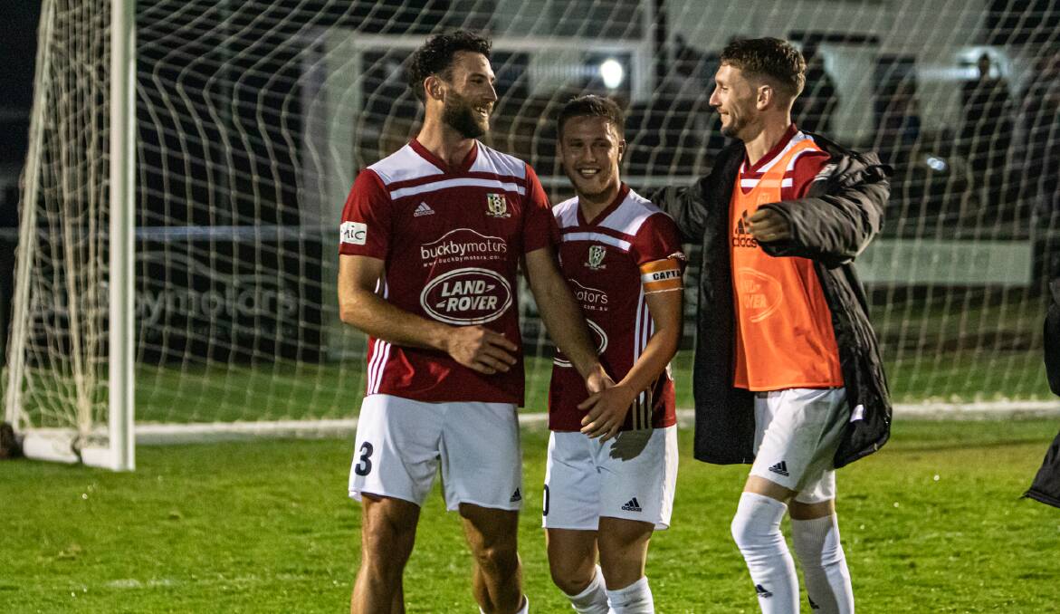 Up for the cup: Jarrod Linger (right) celebrates Launceston City's Lakoseljac Cup win over Olympia with Alex Rossetto. Picture: Jamie Richardson