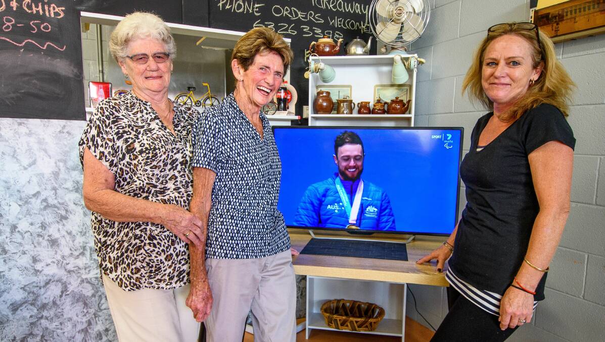 Australian Paralympian Simon Patmore's great aunt Daphne Emanuel, grandmother Coral Patmore and aunt Michelle Patmore watch a replay of Simon's gold medal ceremony. Picture: Scott Gelston. 