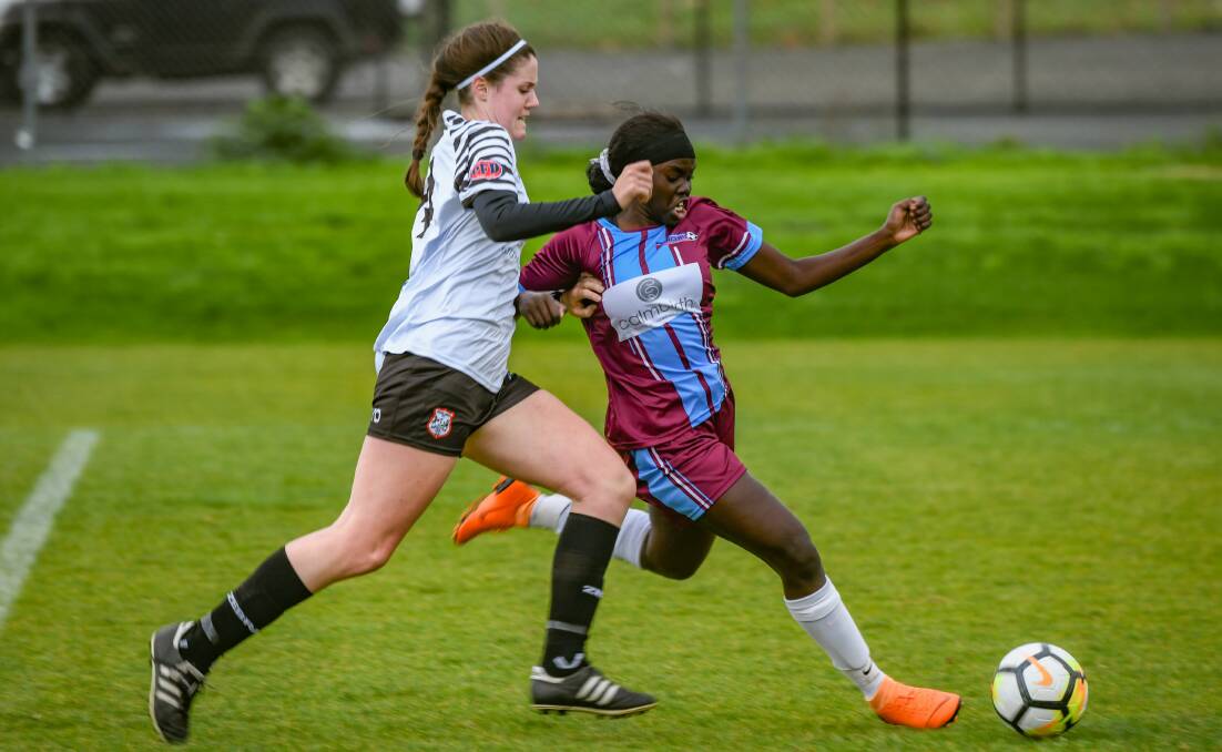 Northern Rangers' Gonya Luate takes on Lily Hutton, of Zebras, in the statewide cup semi-final earlier this season. Picture: Paul Scambler. 