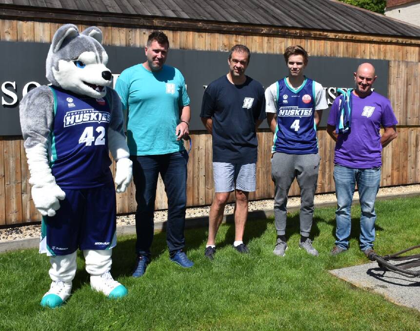 Huskies mascot Mawson, owner Justin Hickey, coach Anthony Stewart, rookie player Jack Stanwix and chief operations officer Mike Sutton.