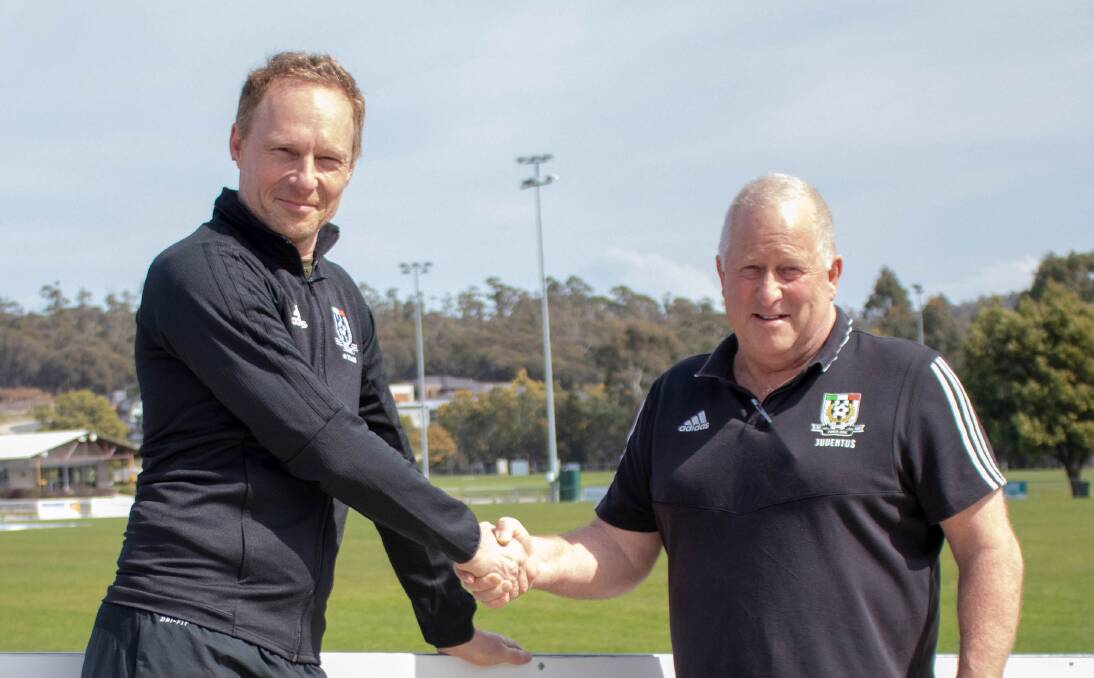 Hard quiz: Roger Hardwicke is welcomed to Launceston City by president Danny Linger.