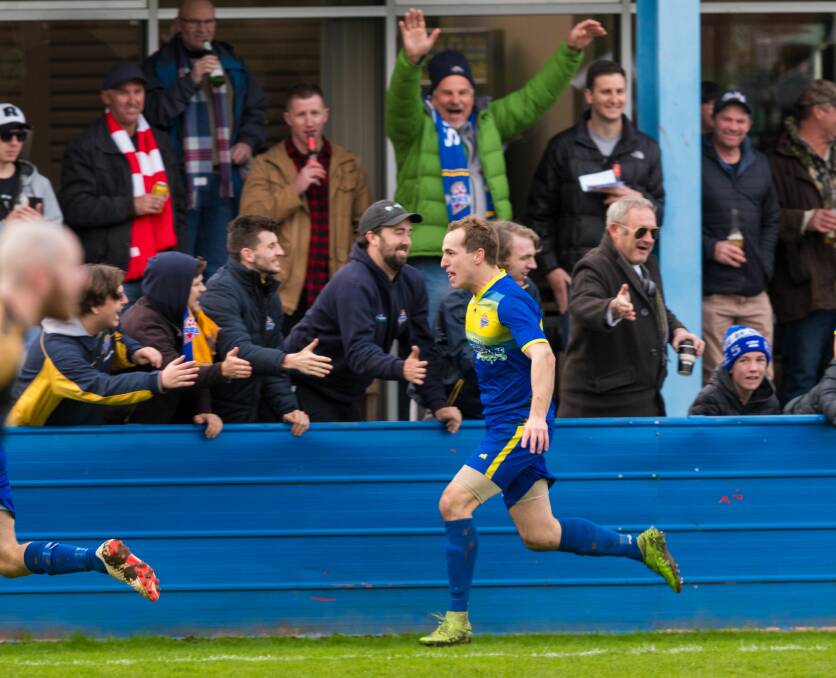Foxy laddie: Miles Barnard celebrates a goal for Devonport Strikers against Olympia on Saturday. Picture: Phillip Biggs