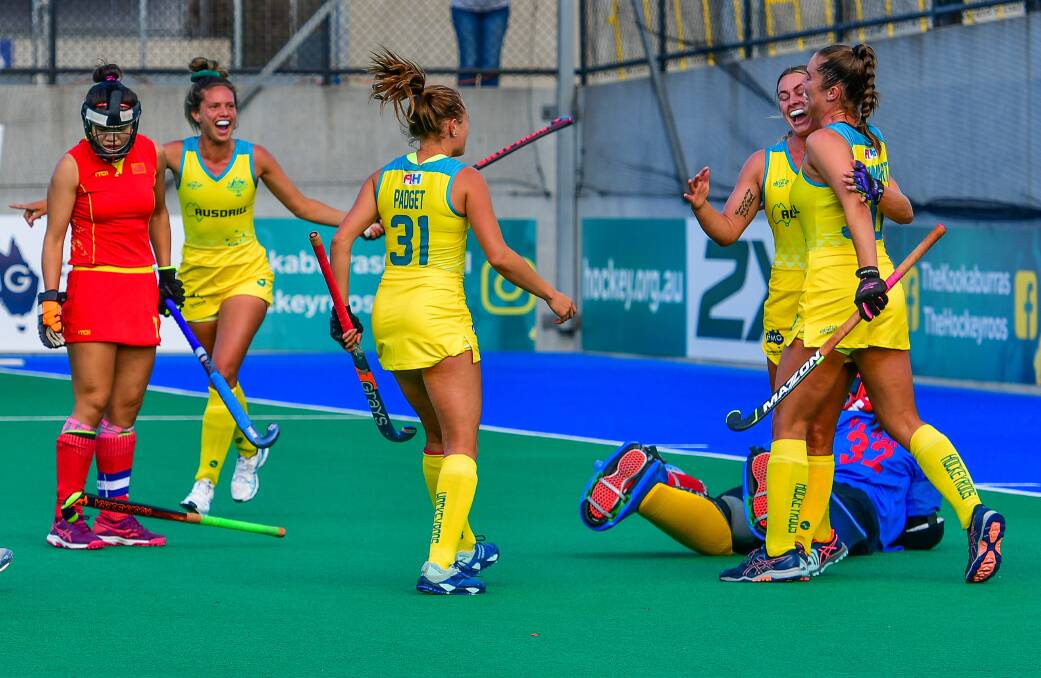 Opening case: Australia's Mariah Williams celebrates scoring the opening goal of the match against China. The Hockeyroos won the game in Hobart 4-3. Picture: Scott Gelston