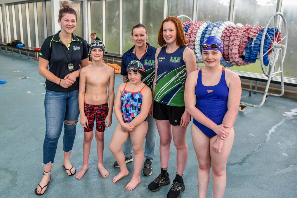 Pent up emotions: Launceston Aquatic Club coaches Isabella French and Merodi Jack with club swimmers Liam Ridley, 12, Jessica Muldoon, 9, Jess Homan, 14, and Charlotte McLennan, 13. Picture: Neil Richardson