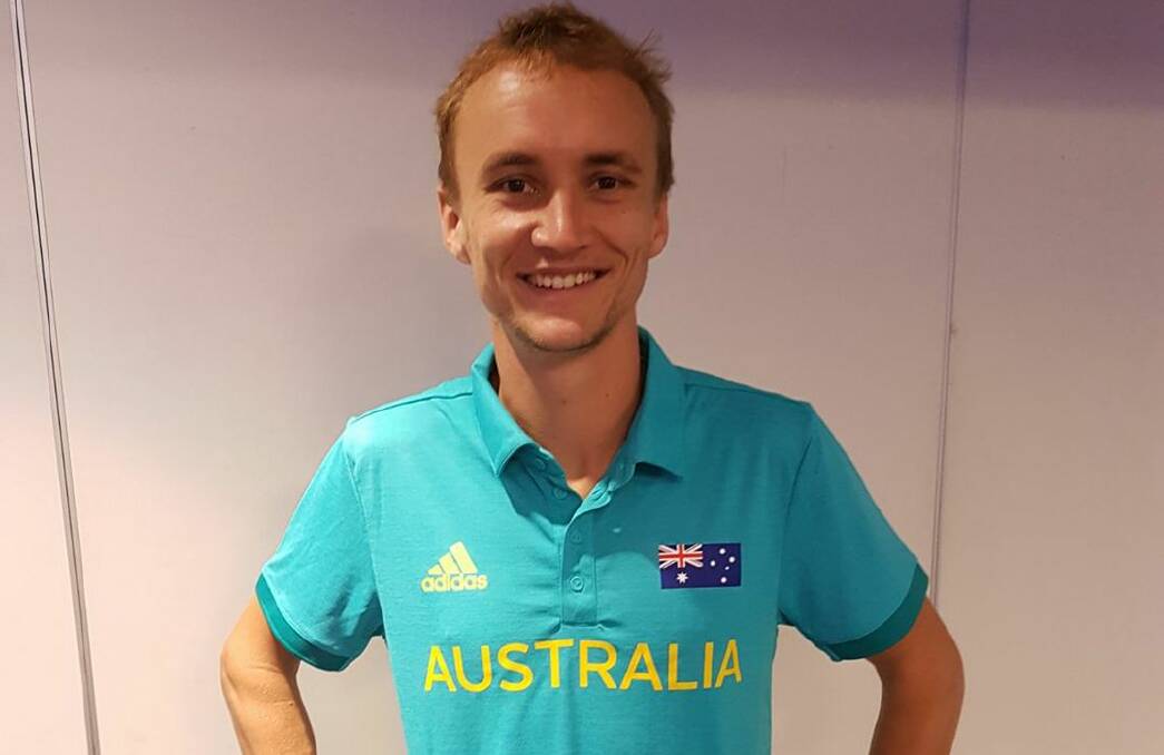 Josh Harris collects his Australian merchandise.