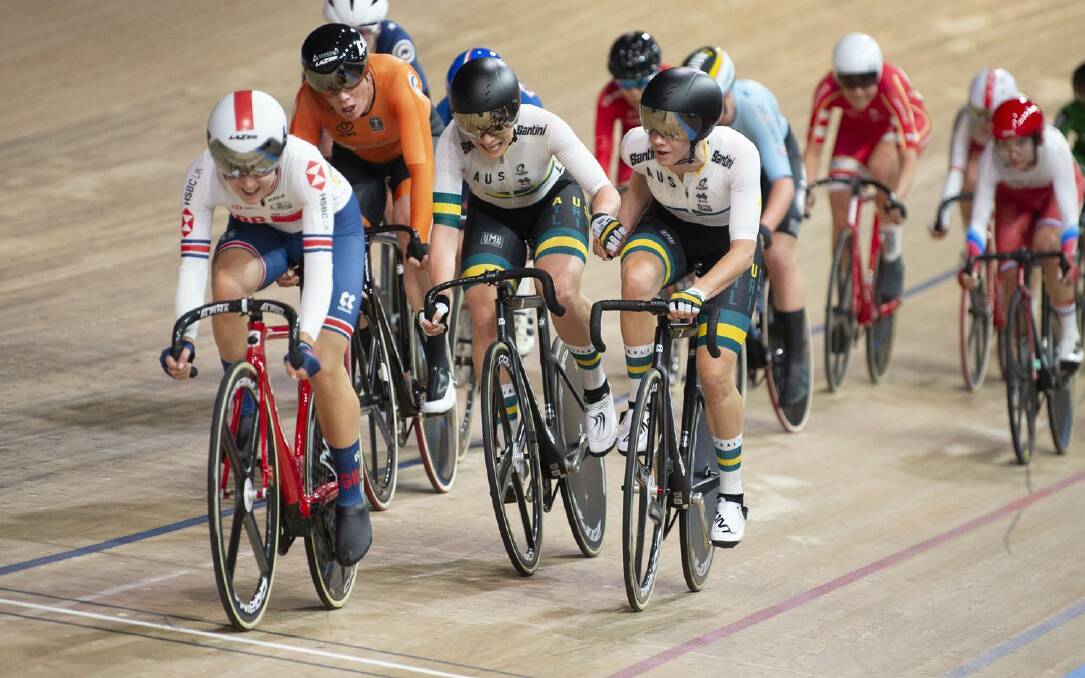 Handover: Annette Edmondson and Amy Cure in the madison at the UCI Track World Championships in Berlin, Germany. Picture: Casey Gibson