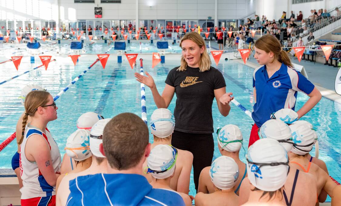 Diving in: Ariarne Titmus coaching young swimmers at Launceston Aquatic Centre on Tuesday. Picture: Phillip Biggs