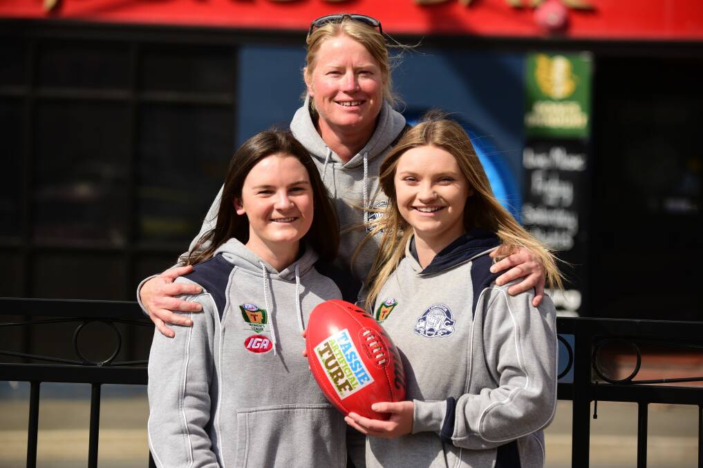 Courtney Webb and Daria Bannister with Launceston Women's Football Club captain Kate Child-Webb in 2016.