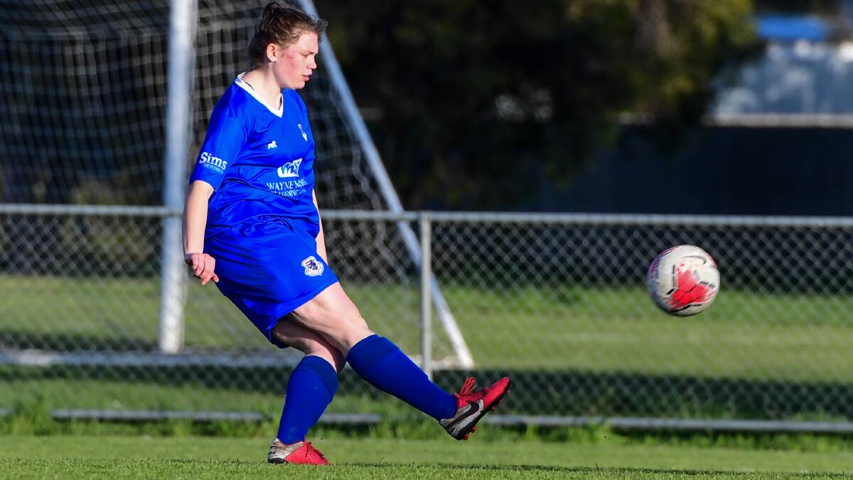 ON THE ATTACK: Jessica Robinson launches the ball forward for Launceston United against Somerset. Picture: Neil Richardson