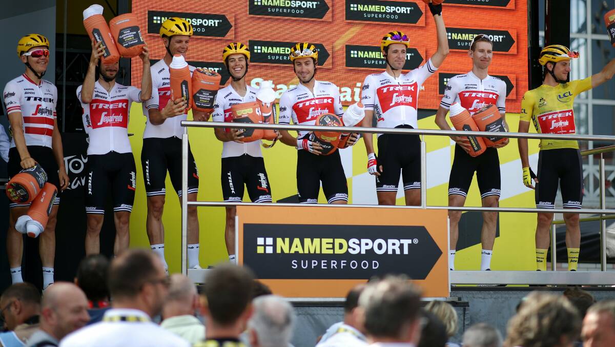 Standing tall: Richie Porte (fourth from left) and his teammates enjoy a Tour de France podium. Picture: Twitter