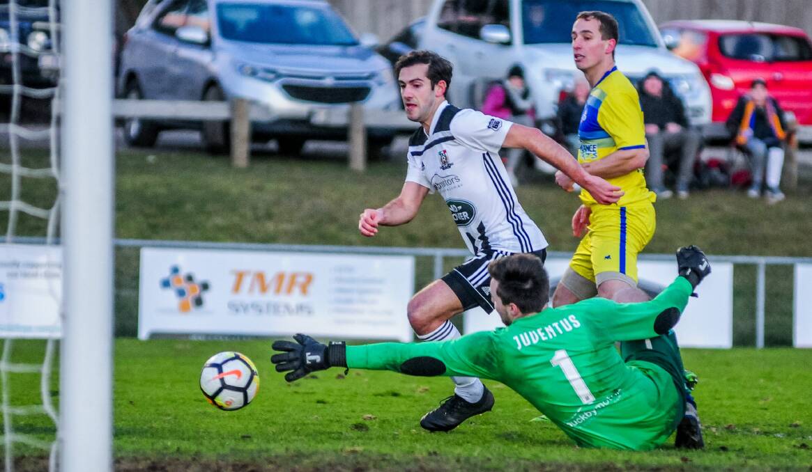 Keep calm: Launceston City's Lachlan Clark makes one of many fine saves to keep his side in the contest against Devonport. Picture: Neil Richardson.