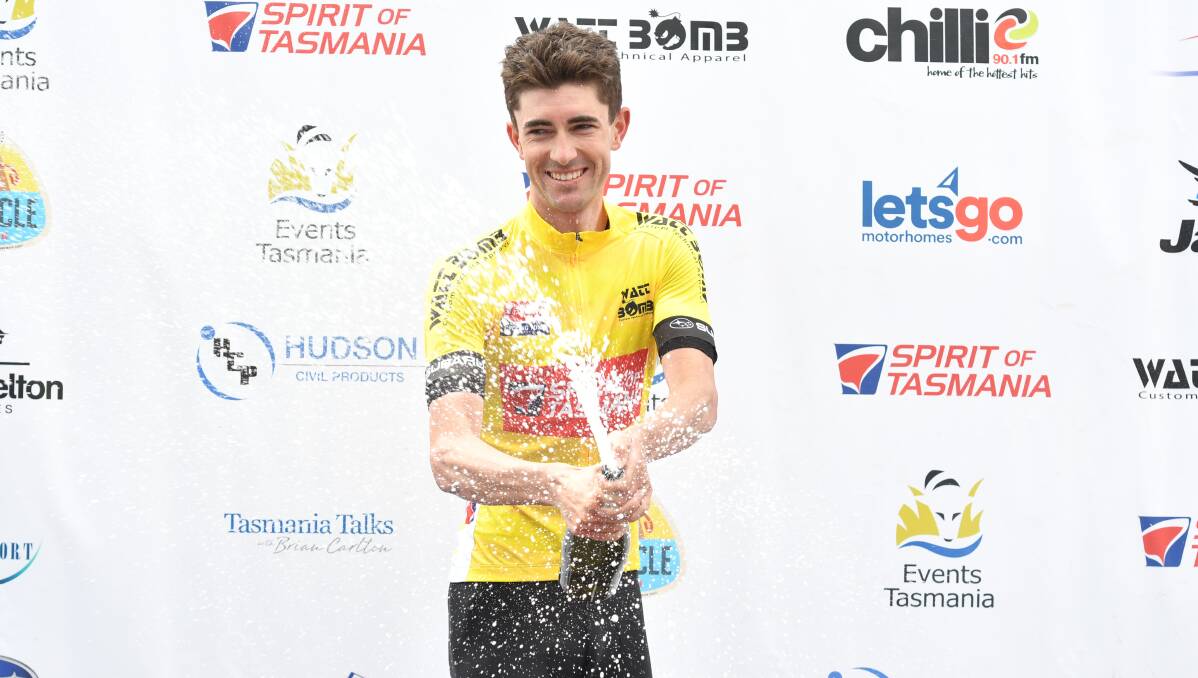 Champagne shower: James Whelan celebrates taking ownership of the Tour of Tasmania yellow jersey. Picture: Brodie Weeding