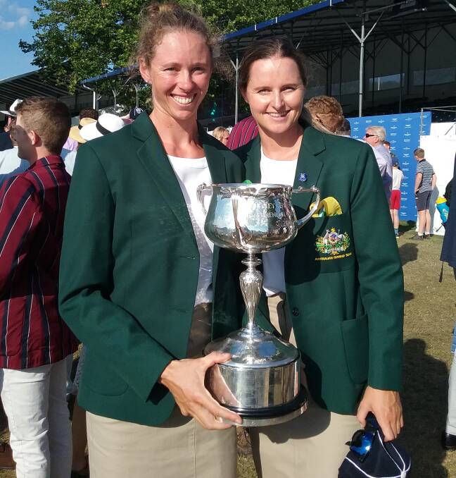 Tasmanians Sarah Hawe and Ciona Wilson with the spoils of victory at Henley.
