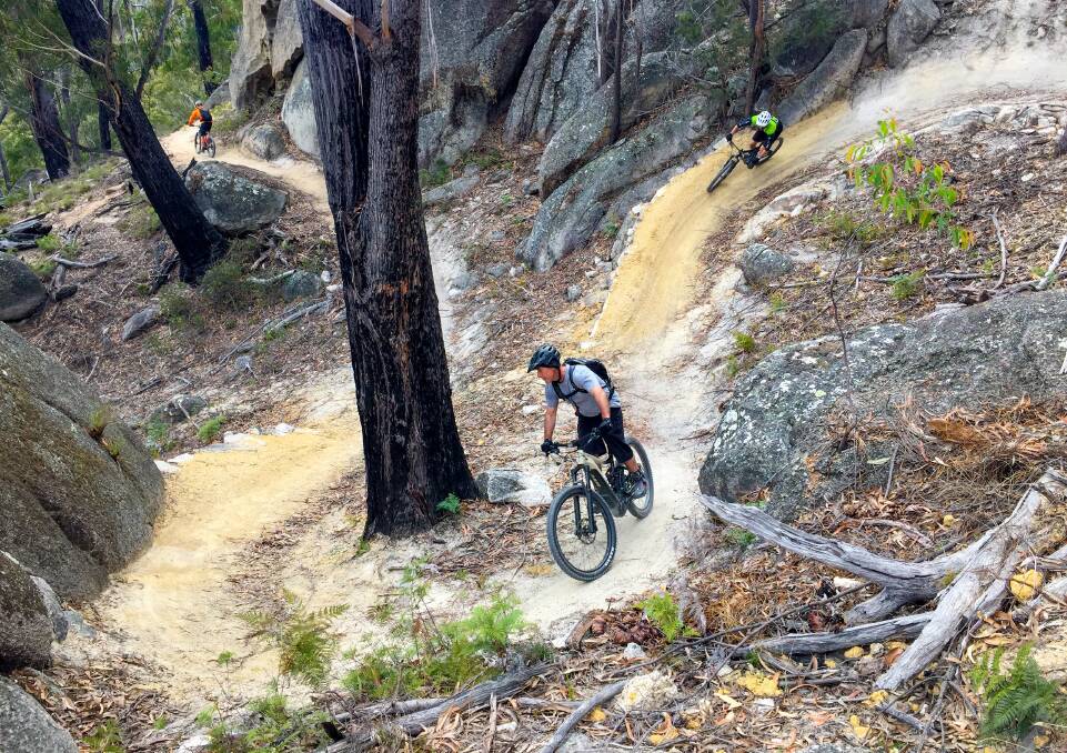Meander valley: Mountain bikers enjoying the sweeping berms of St Helens' Bay of Fires Trail. Pictures: Rob Shaw