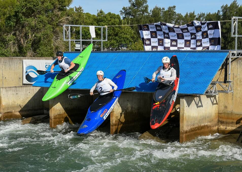 Slippery slope: Daniel Watkins, Lachlan Bassett and Dom Curtin (both NSW) in the extreme canoe slalom final. Pictures: JGR Images