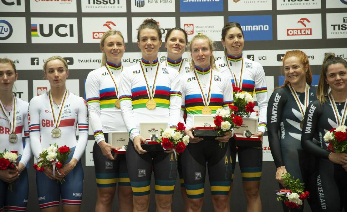 Amy Cure savours world championship gold with her teammates in Poland in 2019. Picture: Casey Gibson