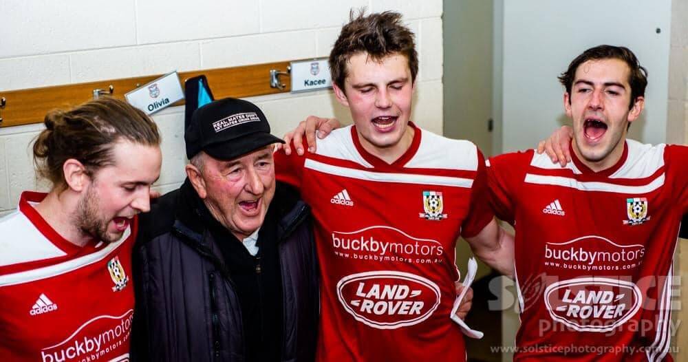 Team player: Kerry Dennis in his element, celebrating with players in the Launceston City change rooms. Picture: Facebook