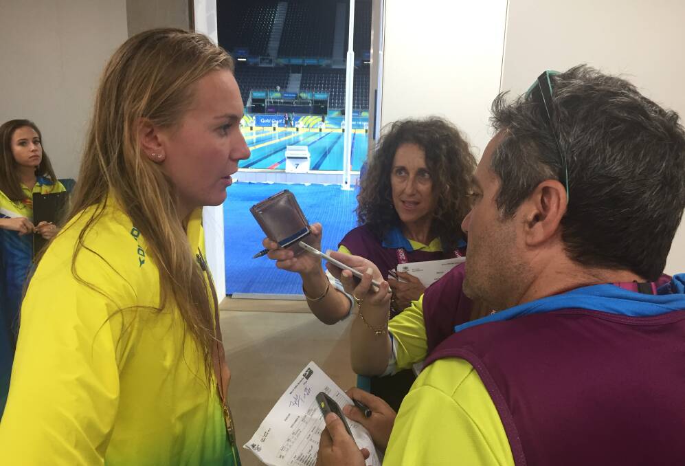 IN THE SPOTLIGHT: Ariarne Titmus became accustomed to medal ceremonies and press attention at the 2018 Commonwealth Games on the Gold Coast. Picture: Rob Shaw