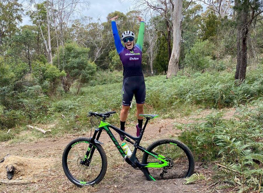 Jumping for joy: Lauren Perry shows how much she is enjoying some mountain bike cross training. Picture: TIS