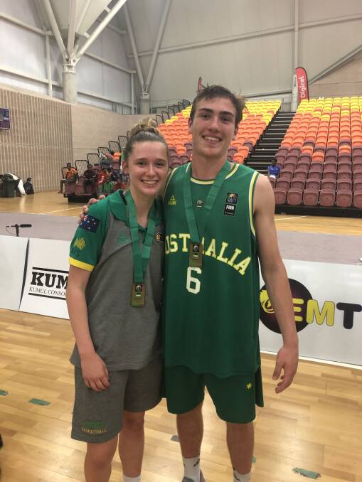 Golden grins: Zoe Crawford and Sejr Deans with their medals the 2018 FIBA under-15 Oceania Championships in Port Moresby.