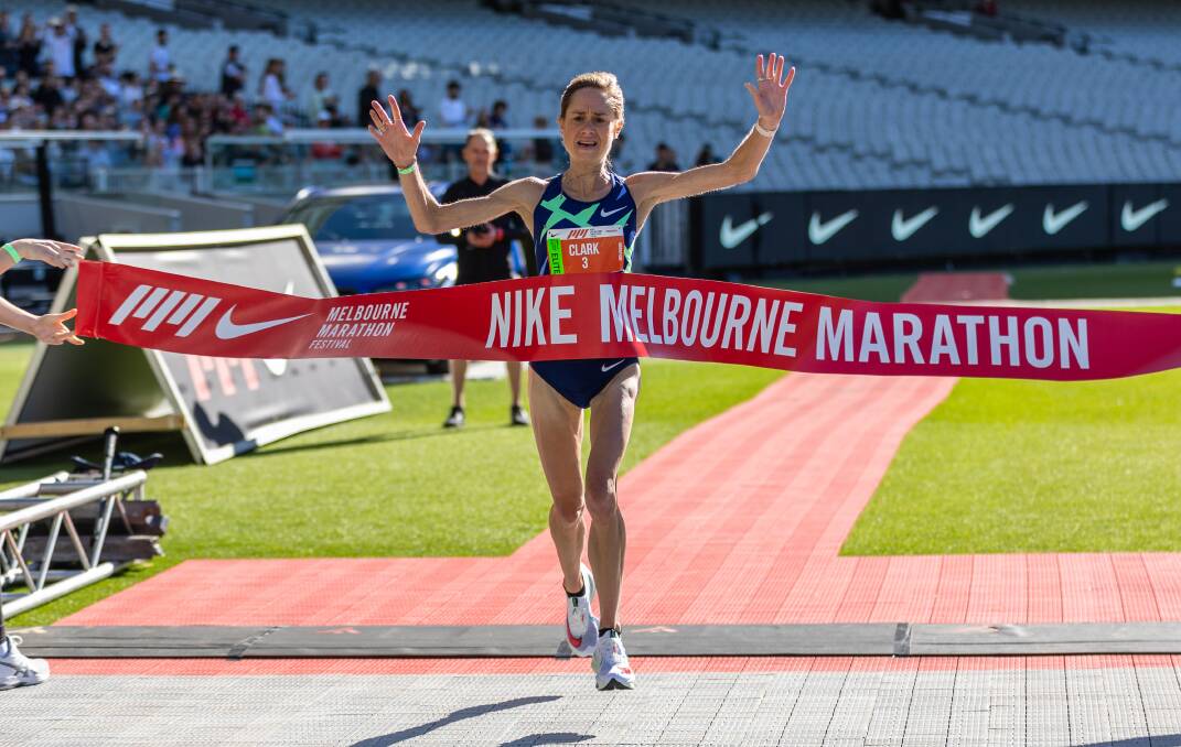 Milly Clark crosses the finish line in the MCG to win the Melbourne Marathon. Picture: Jazz Deol