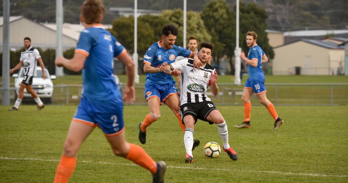 LUCA ME: Riverside's Luca Vigilante gets to grips with Sam Ridgard, of Launceston City, during the NPL Tasmania derby at Prospect Park. Picture: Paul Scambler