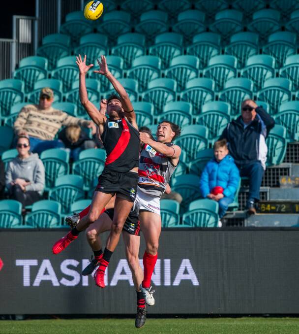 Grand stand: North Launceston's AFL draft prospect Tarryn Thomas marks in front of sparse stands at the State League Grand Final against Lauderdale. Picture: Phillip Biggs
