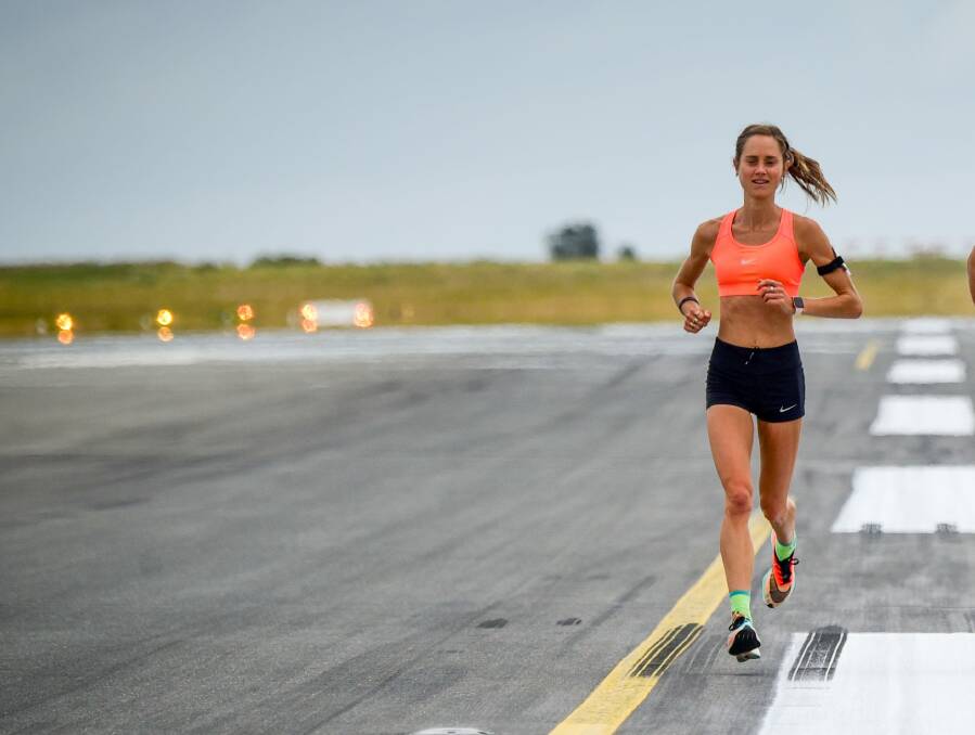 Back down to earth: Rio Olympian Milly Clark promoting the Launceston Running Festival course on the runway at Launceston Airport in November. Picture: Paul Scambler
