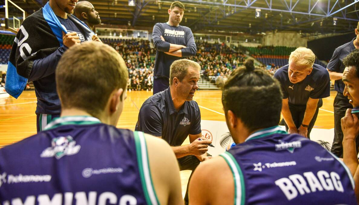 Generation game: The past and future of Tasmanian basketball as NBL stalwart Anthony Stewart coaches a Southern Huskies team featuring rising star Mason Bragg at the Silverdome in July 2019. Picture: Scott Gelston