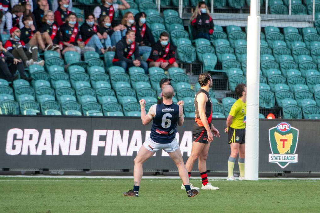 Cheer squad: Michael Musicka endears himself to the North Launceston fans after kicking a goal for Launceston in Sunday's TSL grand final. Picture: Paul Scambler