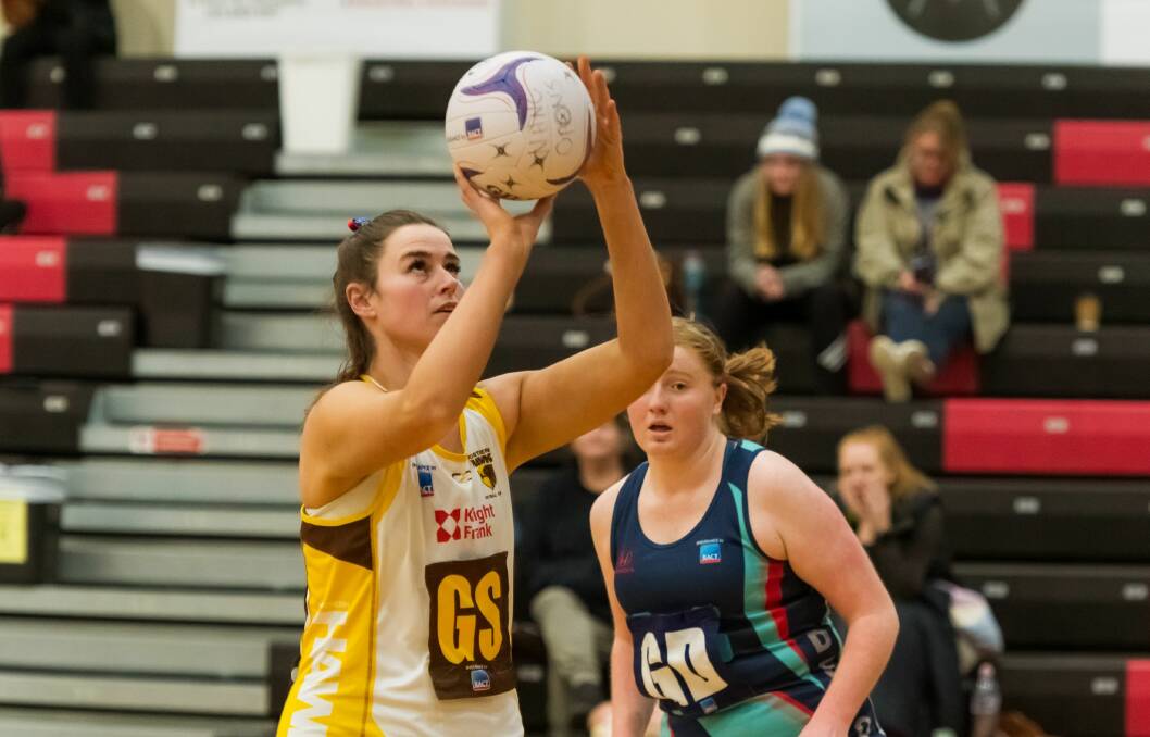On target: Ashlea Mawer in familiar pose shooting for the Northern Hawks. Picture: Simon Sturzaker