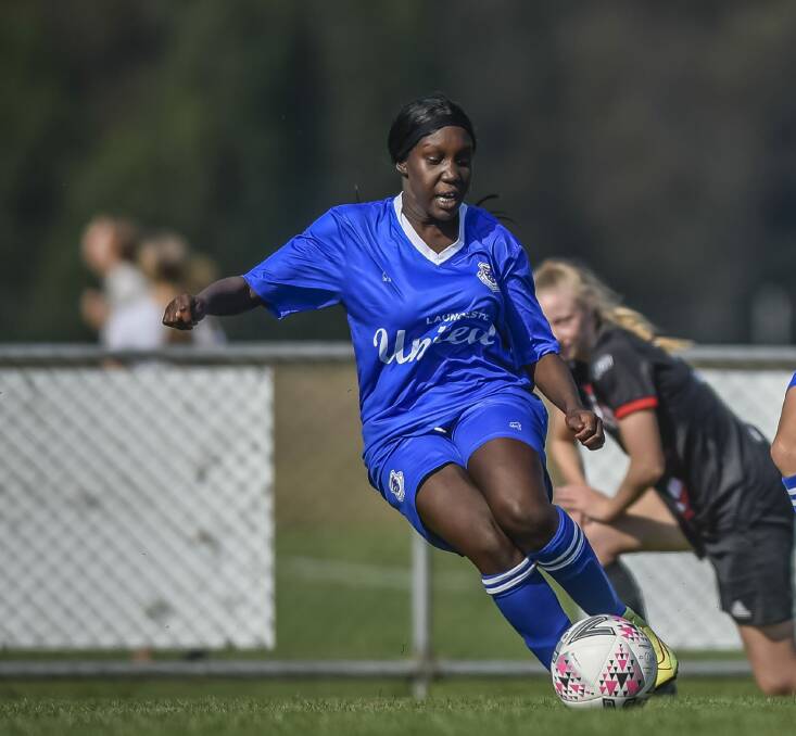 On the ball: Gonya Luate in action for Launceston United against Clarence Zebras. Picture: Craig George