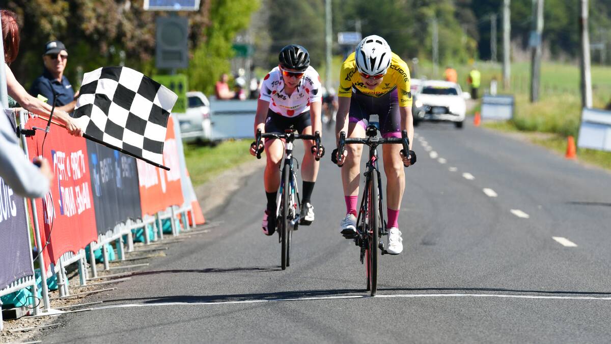 First commandment: Justine Barrow leads Jamie Gunning across the line in Riana after the pair broke away on the second stage of the Tour of Tasmania. Pictures: Brodie Weeding